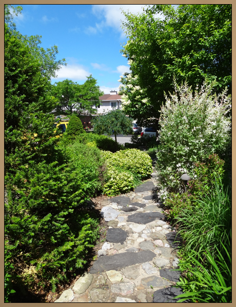 Custom Landscaping Rock Path and Garden Photo