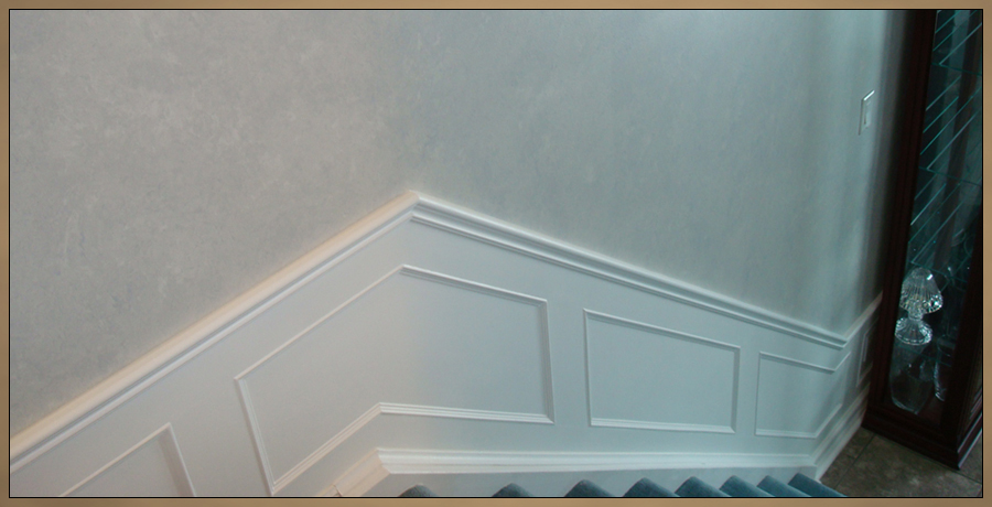 Raised Wainscoting for stairway, painted white with steel blue faux finished walls