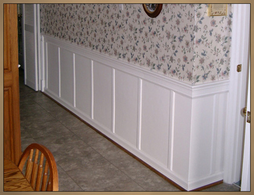 Wainscoting after decorative wall panels installed